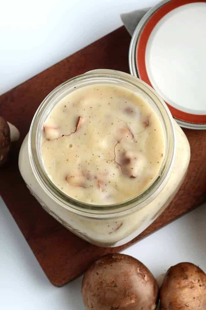 A top view of a mushroom soup stored inside a mason jar