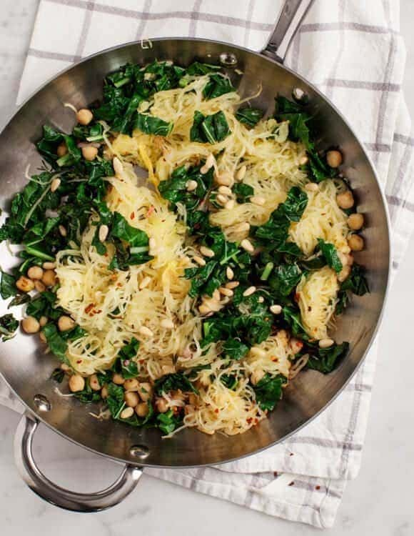 A top view of kale and chickpeas veggie spaghetti squash inside a pan