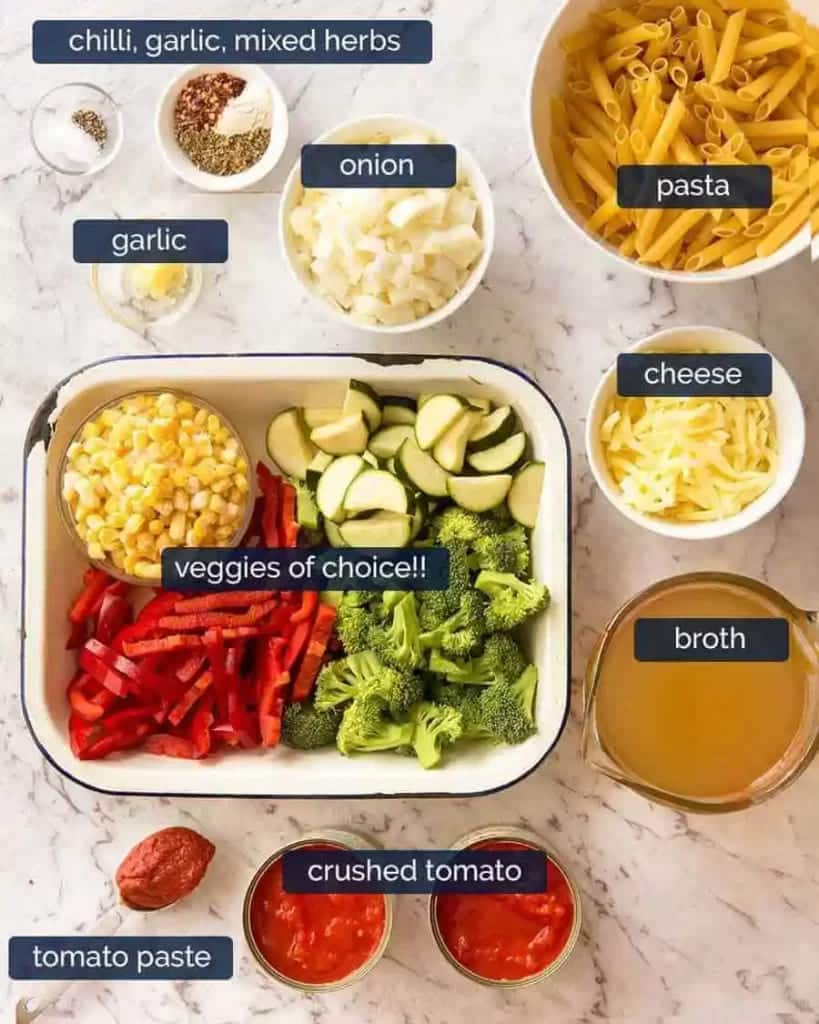 A top view of the ingredients of pasta sauce vegetarian recipe