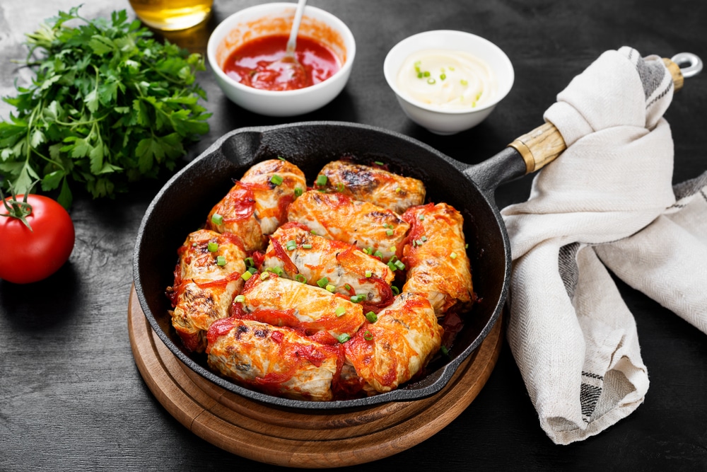 A view of a cabbage rolls in a frying pan