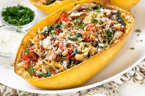 A view of spaghetti squash boat served with sauteed veggies inside