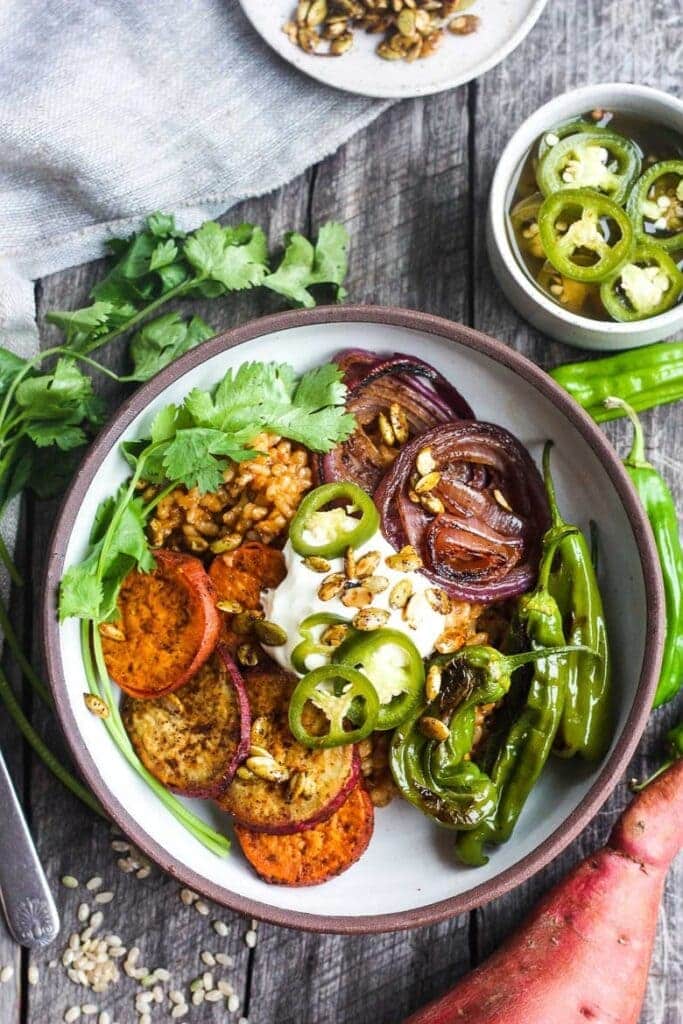 a bowl of mexican rice with roasted vegetables