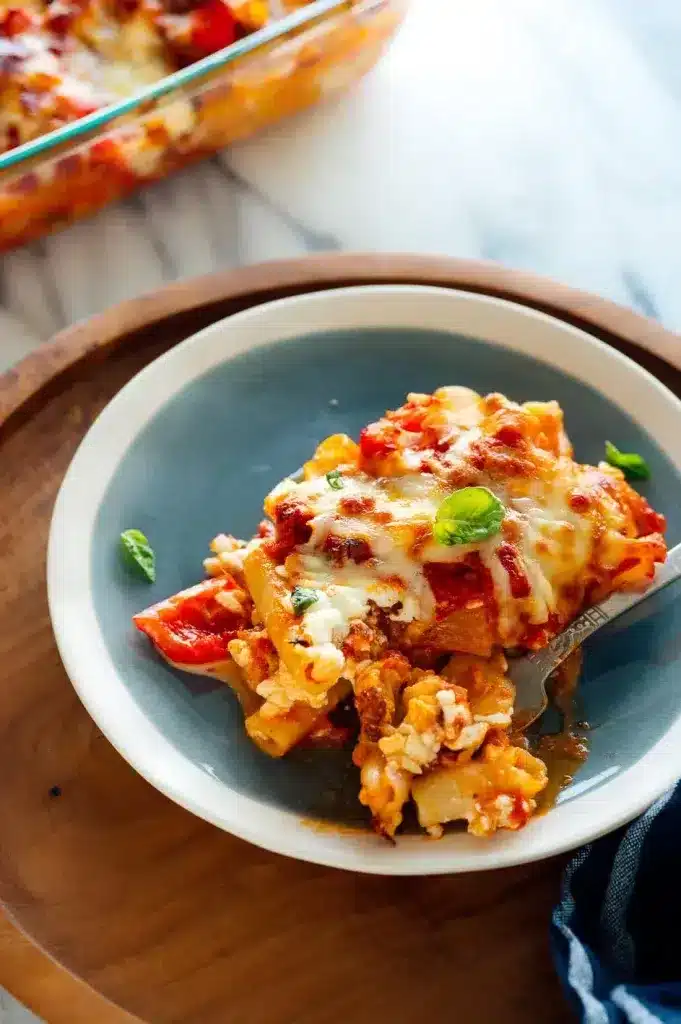 A cheesy slice of baked cheesy ziti plated out