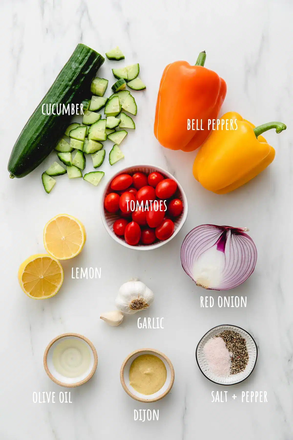 A top view of ingredients for vegetarian salad recipes labeled