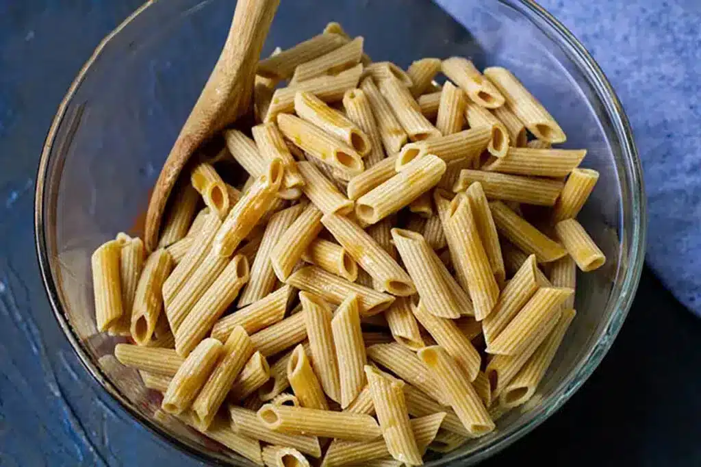 A top view of ziti pasta inside a bowl