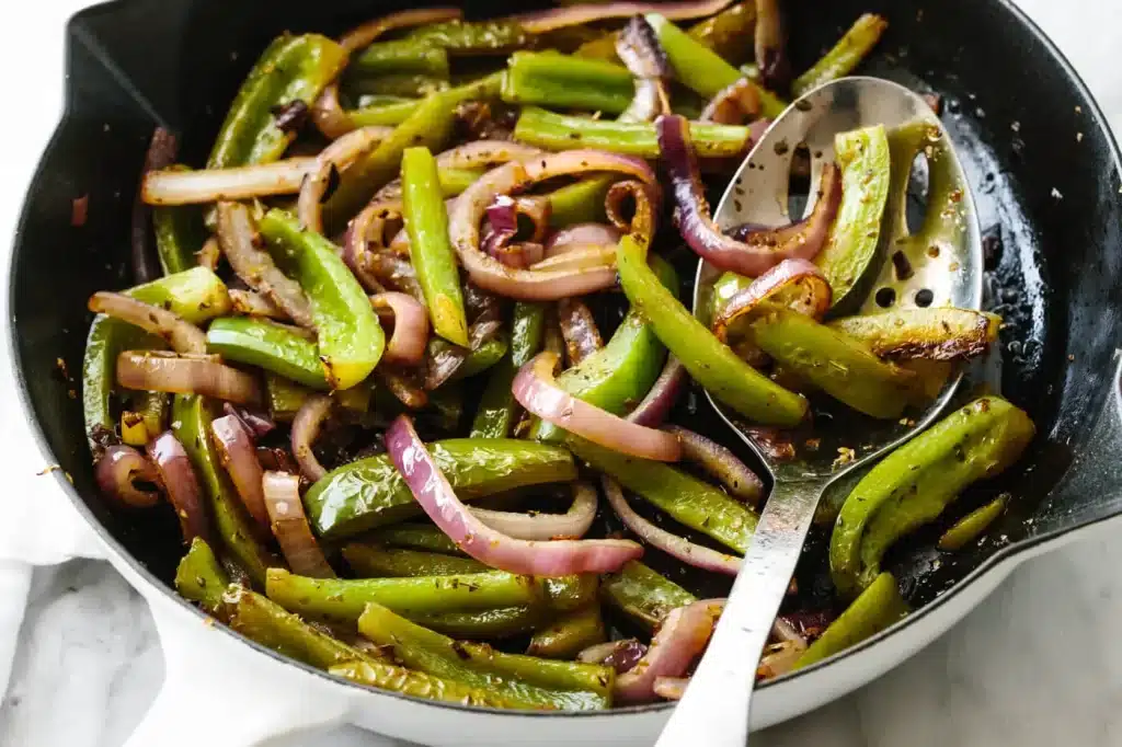 A view of green chili veggie fajita inside a pan