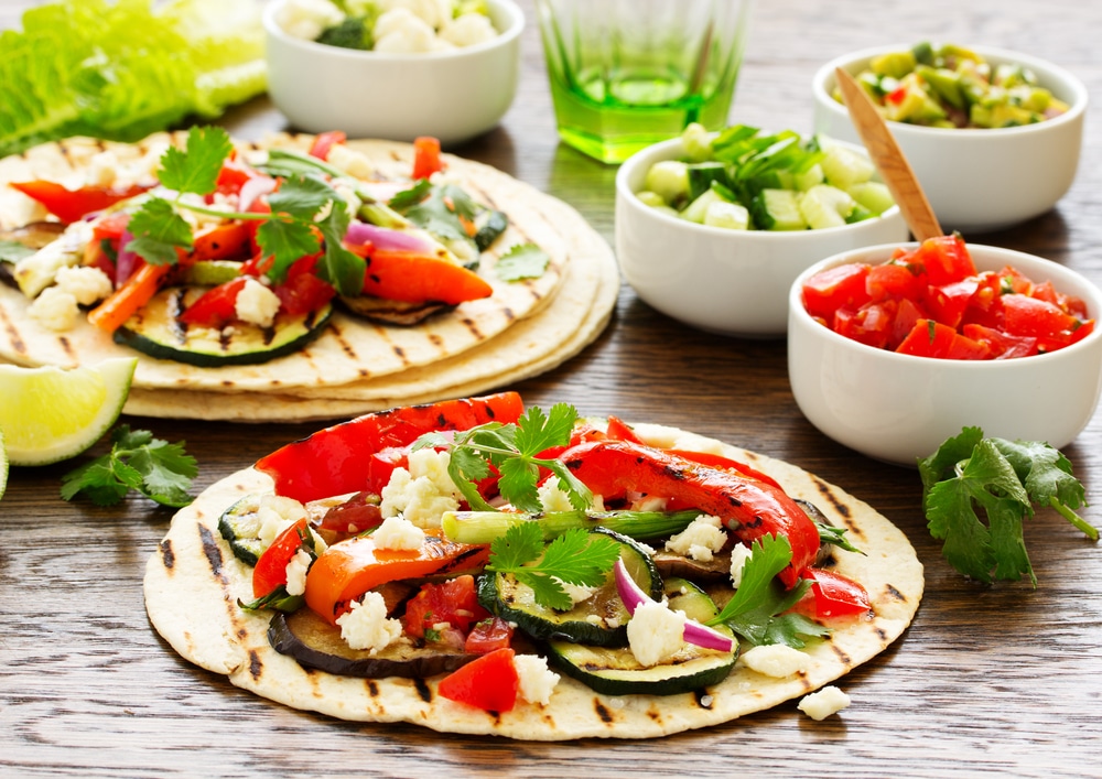 A view of vegetarian fajitas inisde taco wrap