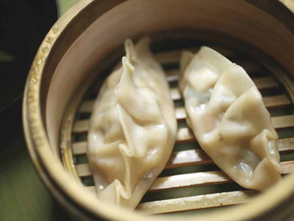 A view of veggie dumplings being steamed