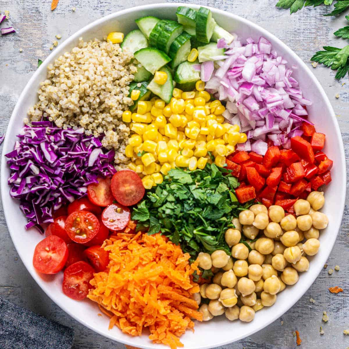 An overhead view of colorful rainbow plate of salad