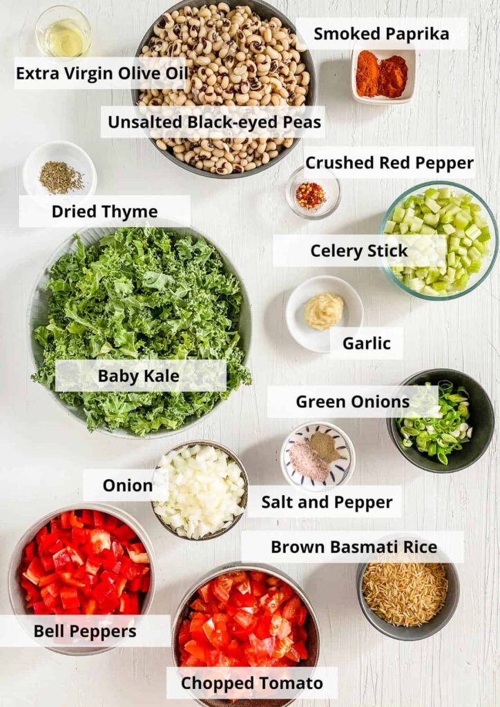 An overhead view of ingredients labeled of black eyes peas recipe