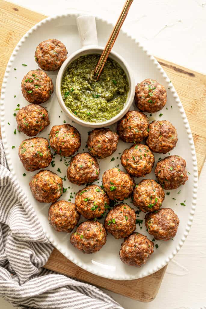 A top view meatballs dished out with green chutney