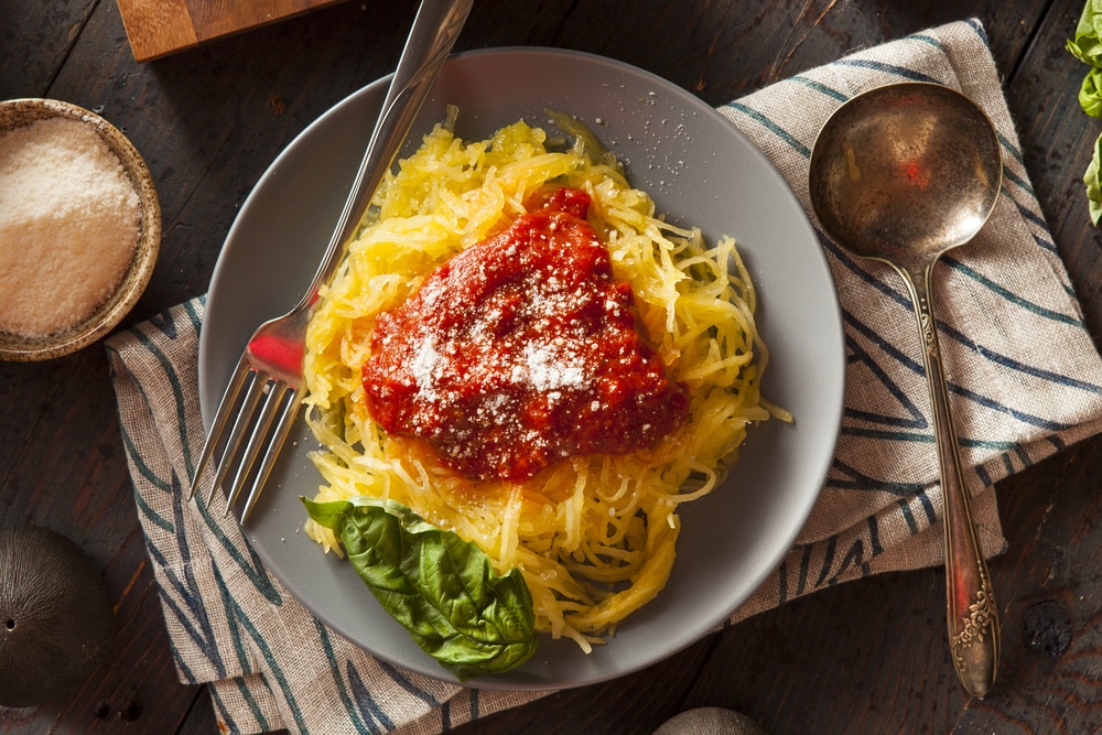 A top view of spaghetti squash with tomato sauce