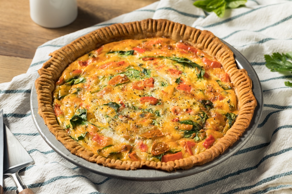 A view of a vegetarian quiche inside a baking pan