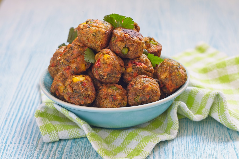 A view of vegan meatballs inside a bowl