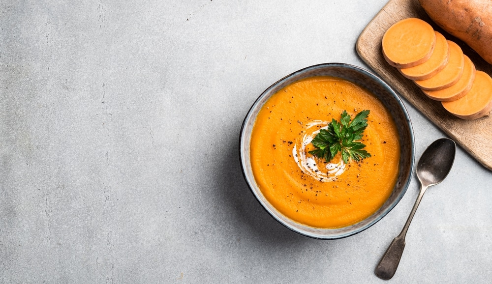 A top view of a sweet potato soup in a bowl