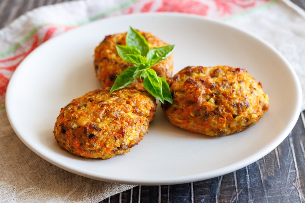 A view of spanish meatlballs in a plate with cilantro garnish